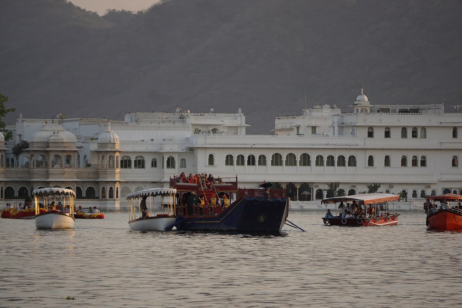 A palace courtyard laid out for a wedding function at dusk.