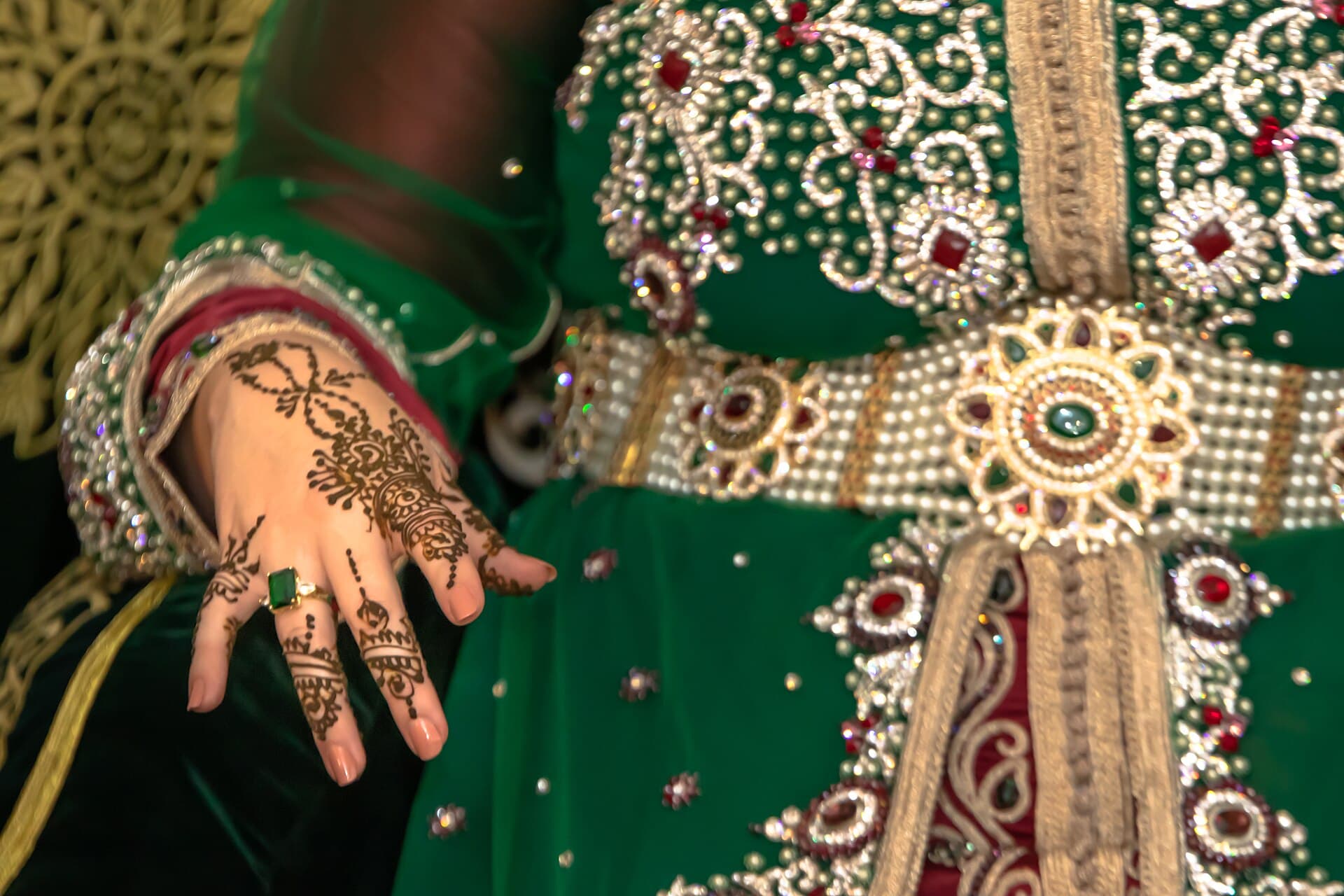 Low floor seating with bolsters arranged for a mehndi function.
